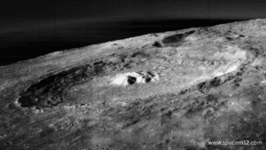 "Moon Mountain on the lunar surface featuring rugged peaks and craters illuminated by sunlight."